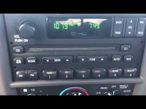 How do you set the clock on a 2001 Ford Expedition?