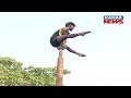 young individual demonstrates pole mallakhamb art at patha utsav in bhubaneswar