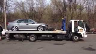 Unloading a car off of a flatbed