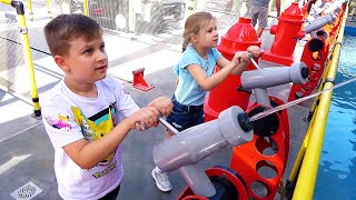 Diana and Roma interact with fun exhibits at the Legoland