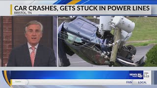 VIDEO: Car crashes, gets stuck in power lines
