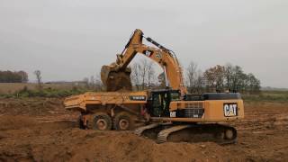 CAT 345D LME lädt Volvo Dumper / Bauunternehmung GRANIT Graz