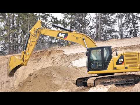 How much does a CAT 320 excavator weigh?