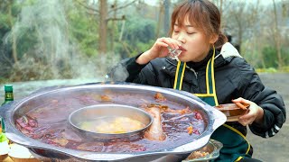 Hot pot in cold weather, soup with big bones of sheep, soup and meat with white wine