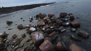 Drone DJI FPV. Low flight over rocks and water. Tilgu sadam 4k 60fps.