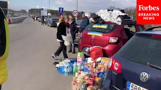 Thousands Of Ukrainians Fleeing The Country On Foot, Seeking Refuge In Poland And Rest Of EU