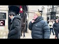 7 moments guard reprimanded tourists do not touch my horse behind the white line.