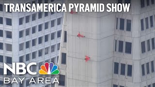 Aerialists rappel down Transamerica Pyramid in San Francisco