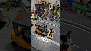 Painter is painting Jungheinrich Lego Forklift Truck Transport Micky Mouse