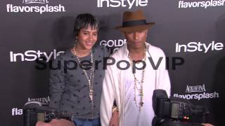 Pharrell Williams, Helen Lasichanh at The Hollywood Forei...