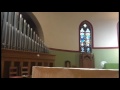 Organist Seth Clark demonstrates improved sound of organ at St. Paul's Episcopal Church in Holyoke