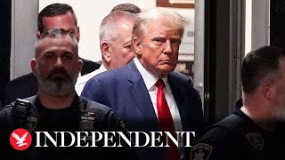 Donald Trump silent as he enters courtroom before pleading not guilty for fraud