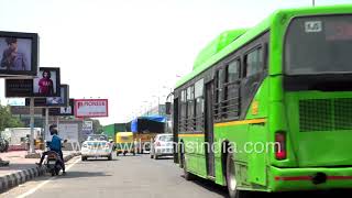 South Extension traffic - Deserted DTC Green Bus, lorry trucks in the afternoon