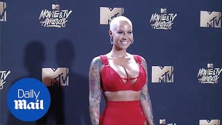 Amber Rose flaunts busty chest at MTV Movie and TV Awards - Daily Mail