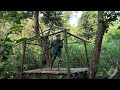 camping alone in the wild building a safe tree shelter