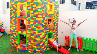 Vlad and Niki play with colored toy blocks and build Three Level House
