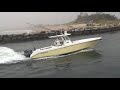 boat entering the quonochontaug breachway