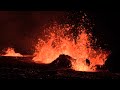 red lava spews from iceland volcano eruption at night afp