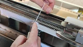 Casting off around the gate pegs, Brother knitting machine.