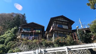 A village of old folk houses living far above a deep and steep valley