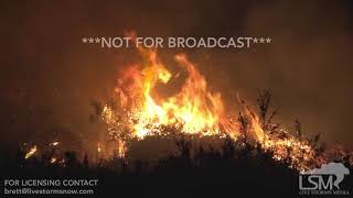 STOCK - 12-7-2017 - La Conchita, CA - Thomas fire burning towards houses with Christmas lights - Heg