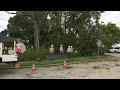 Crews work to clear tree that took down power line in Katy