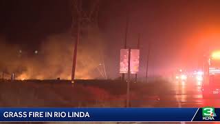 Crews battle a grass fire in Rio Linda near Kasser Road and Tan Wood Road.