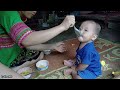 young girl and abandoned baby making corn porridge to eat making corn drying floor