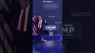 Trump mocks Biden by appearing clueless on stage