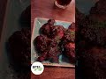 “ultimate bbq feast eating the best chicken wings drenched in barbecue sauce ”