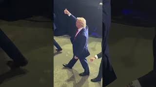 Shocking moment a cell phone is THROWN at Trump