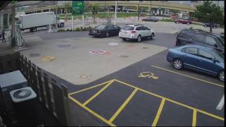 Raw Video: Woman jumps on car to stop carjacking