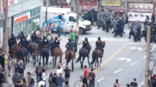 Toronto Riot Police and Mounted Unit Swarm G20 Protesters and Bystanders