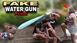 FAKE WATER GUN "PUBLIC PRANK" | with wonderful voice