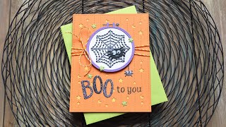 Stitching on a Halloween card with Chari