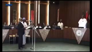 President Buhari swears in 23 NPC Commissioners, Code of Conduct members