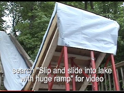 Slip and slide into lake with huge ramp Slip and slide into lake with huge ramp