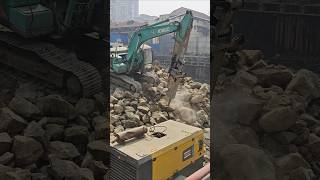 Rock breaking with poclain. #construction #siteengineering