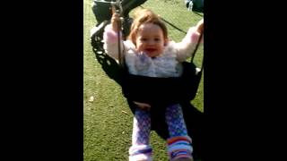 Aria 9 months old. First time on swing