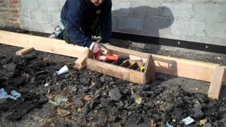 Curb and sidewalk forms and expansion joint.