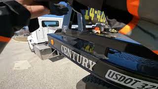 Putting a car into a tow bed.