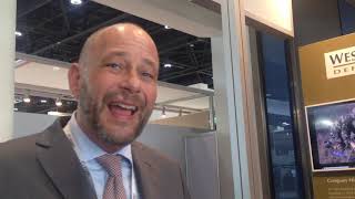 Jan Dirk Hellwege, MD, Wescom Defence briefing about products at IDEX 2019 to Chaitali Bag ADU