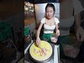 Beautiful Thai Lady Making Delicious Crepes at Bangkok street food Thailand