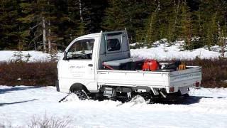 Mitsubishi Mini Cab with Mattracks in 3ft of slush on a ski run end of May