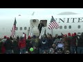 trump throws maga hats to supporters at pennsylvania rally afp