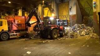 Refuse sorting at a recycling center with a HUDDIG 1060C