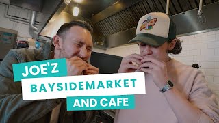 Trying the tasty food at Joe'z Bayside Market and Cafe in Seattle