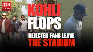 Dejected fans leave the stadium as Virat Kohli flops on return