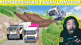 MEMBERSIHKAN TANAH LONGSOR YANG MENUTUPI JALAN RAYA DENGAN ALAT BERAT DAN DUMP TRUCK