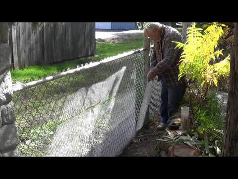 Converting my chain link fence to a stone wall Converting my chain link fence to a stone wall